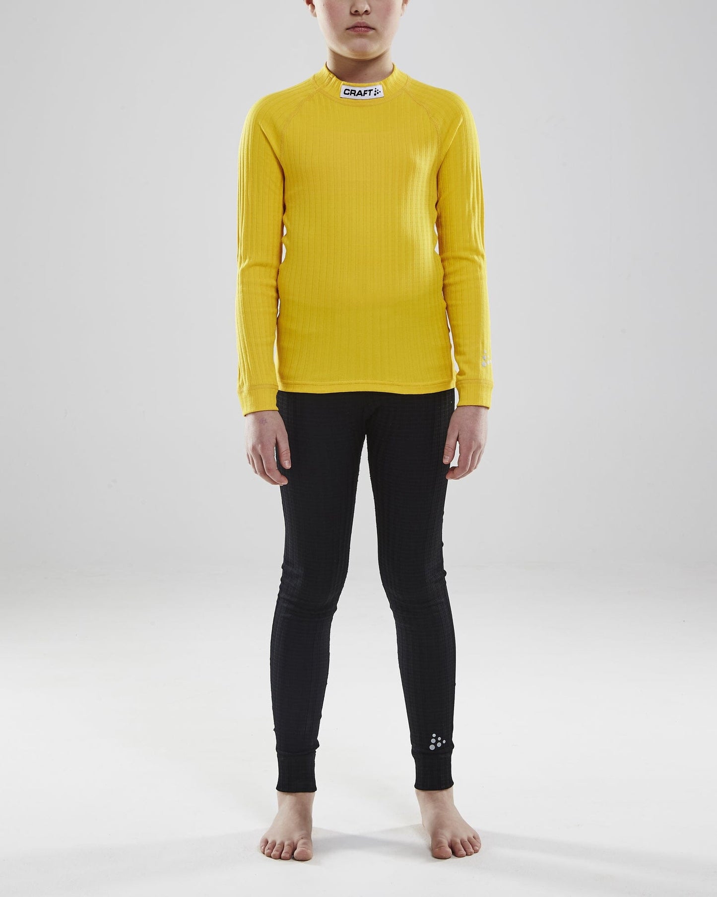 Junior Progress Baselayer CN LS - Sweden Yellow/Black Craft Sportswear NA