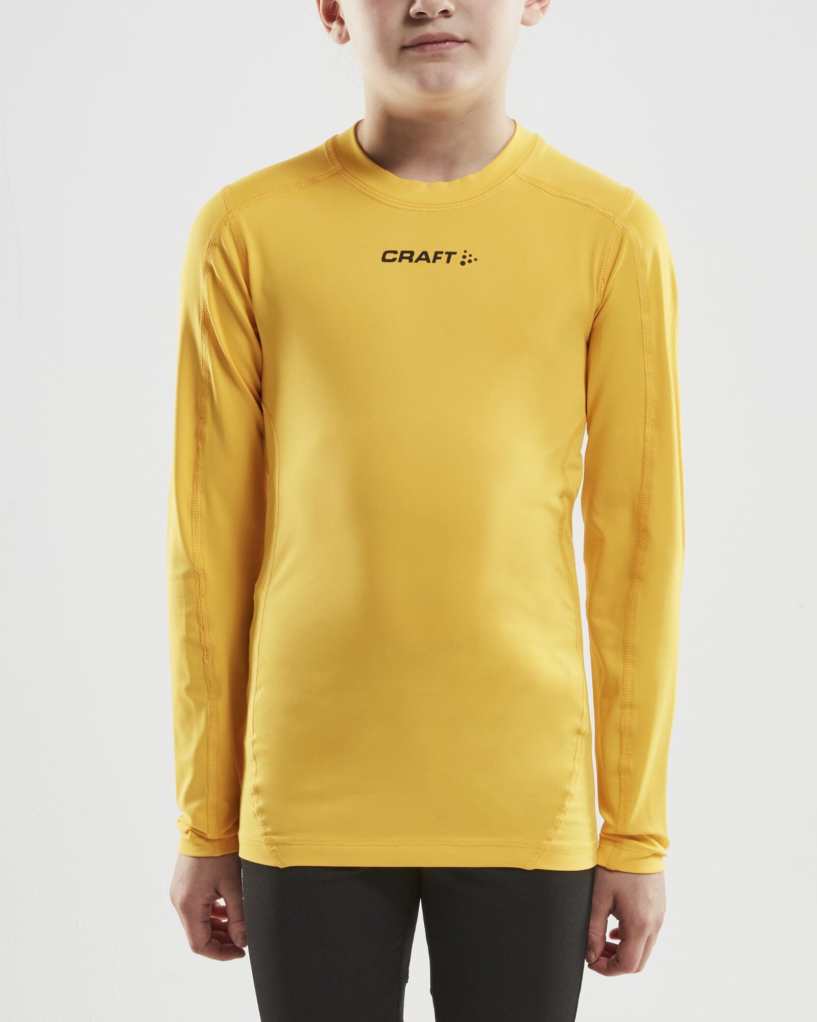 Junior Ability Compression Long Sleeve - Yellow Craft Sportswear NA
